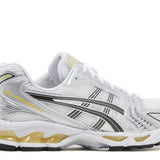Gel Kayano 14 running shoe in white with Tai-Chi yellow accents
