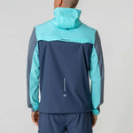 Reprimo Flight Windbreaker in cyan and navy, back view.