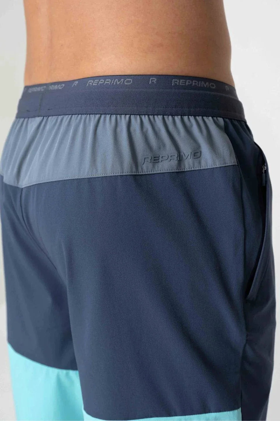 Reprimo Flight Shorts in cyan and navy colors.