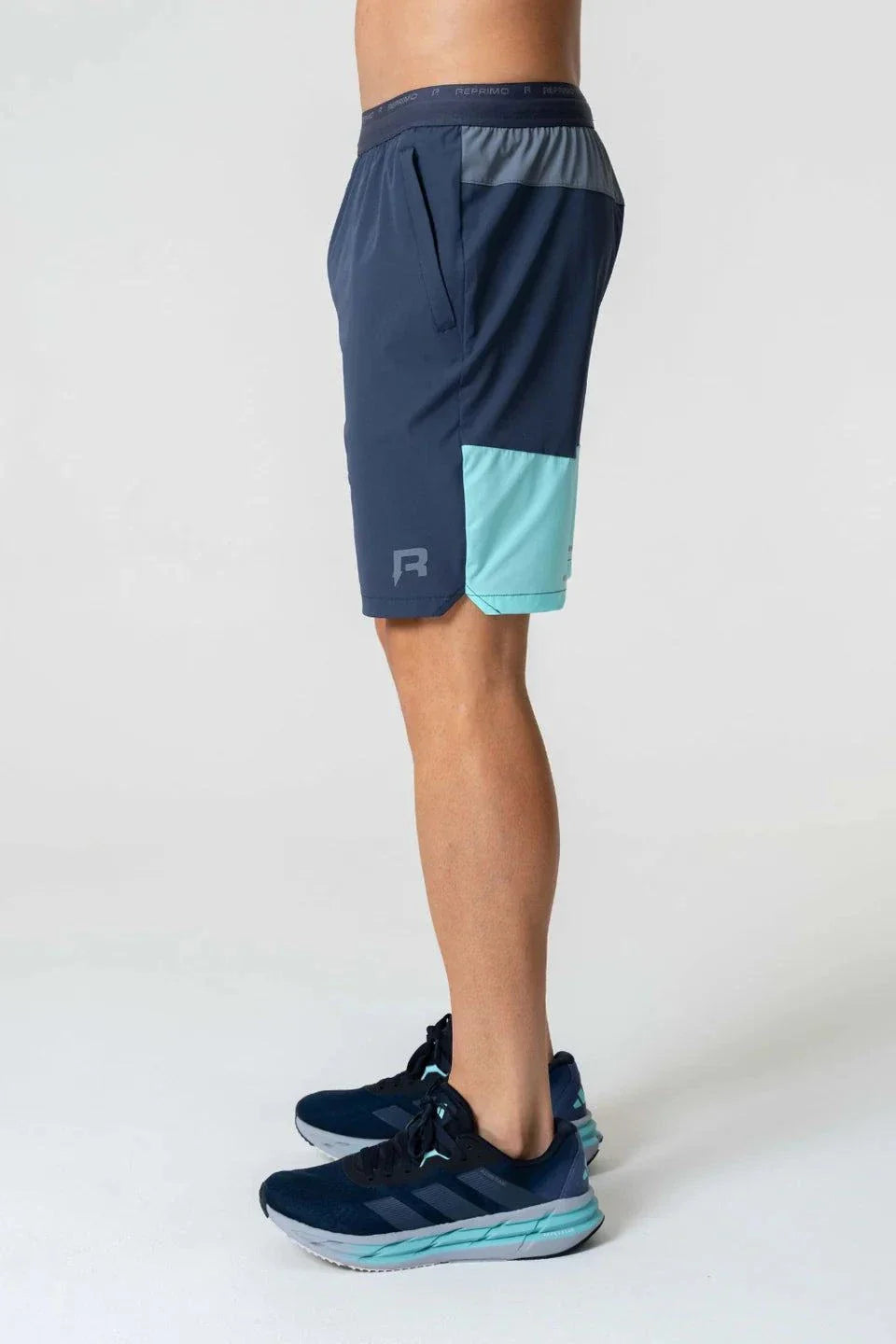 Reprimo Flight Shorts in Cyan/Navy worn by a person.