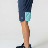 Reprimo Flight Shorts in Cyan/Navy worn by a person.