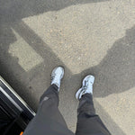 Studio By Charles charcoal grey trackpants worn with white sneakers on pavement background