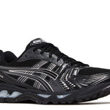 Gel Kayano 14 black running shoe with pure silver accents and mesh upper