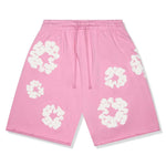 Pink Denim Tears cotton wreath sweatshorts with white floral prints and adjustable drawstring waistband