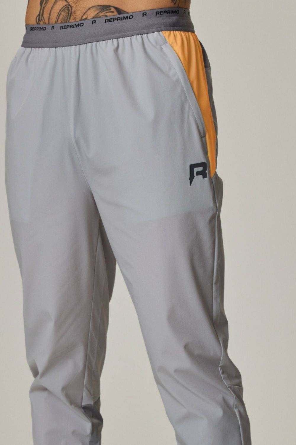 Reprimo Flight Pants in grey and orange design.