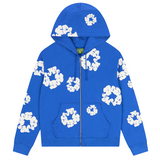 Blue Denim Tears zip-up hoodie with white cotton wreath patterns and front pockets