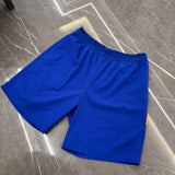 Studio By Charles royal blue studio shorts with elastic waistband on gray marble floor