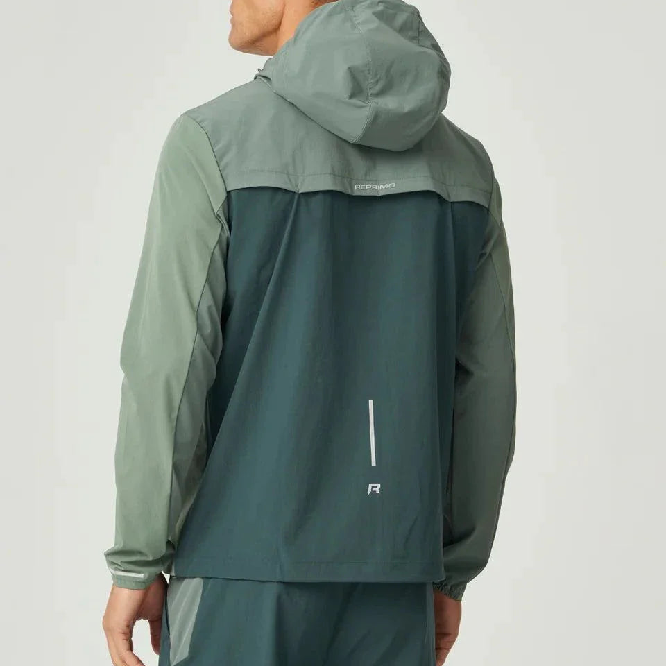 Reprimo Flight Windbreaker in hunter green and botanical colors with hood, zip pockets, and back vent for ventilation, designed for lightweight weather protection.