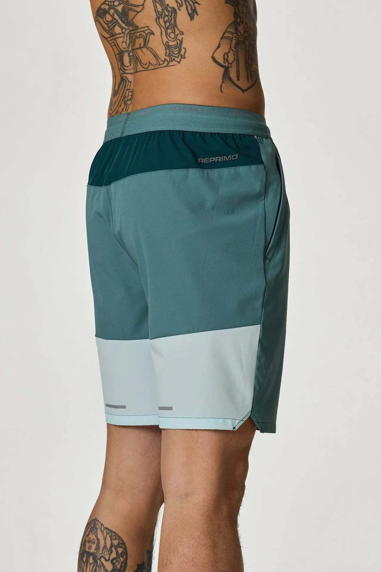 Reprimo Flight Shorts in Forest Green and Mint on model.