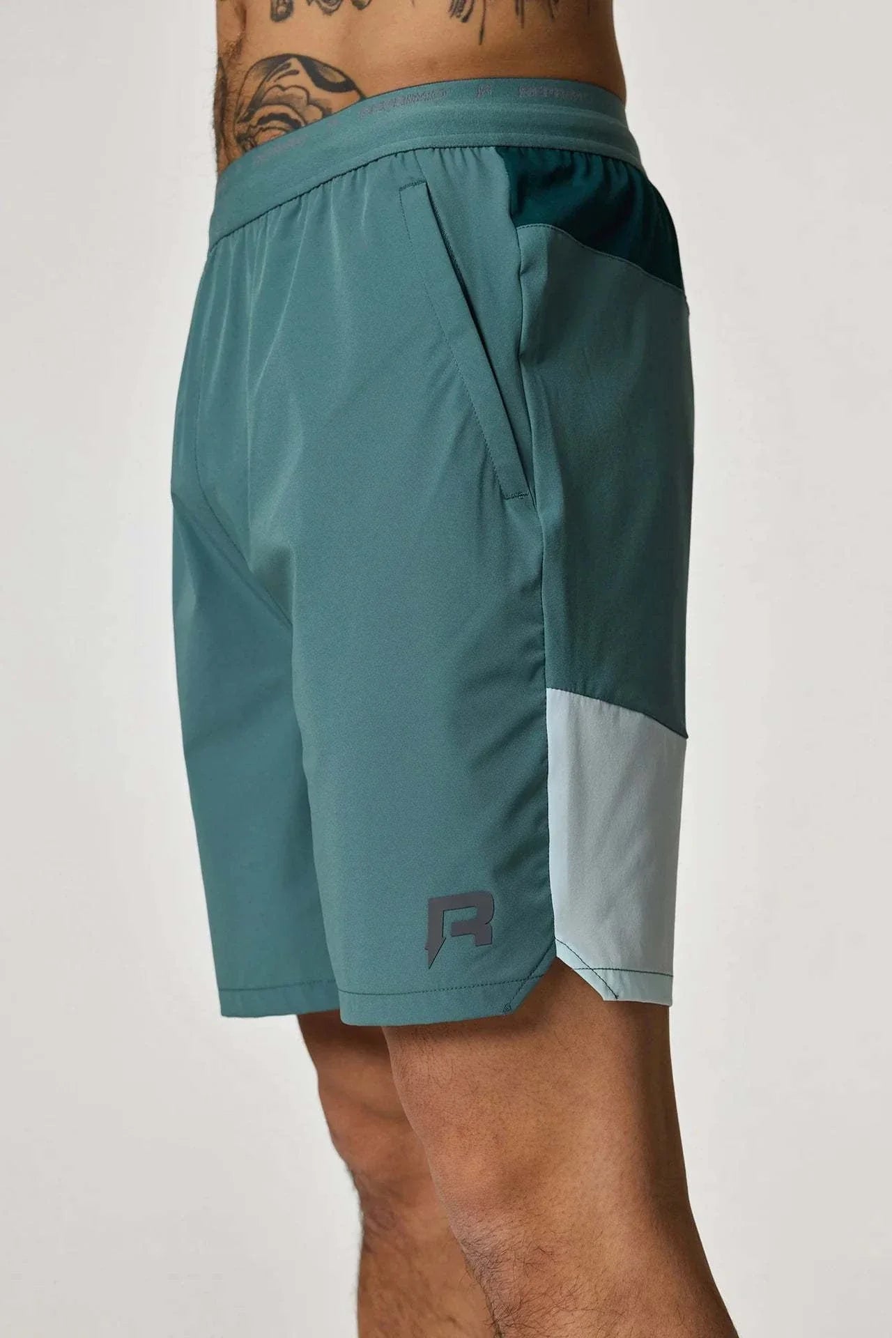 Reprimo Flight Shorts in forest green and mint.