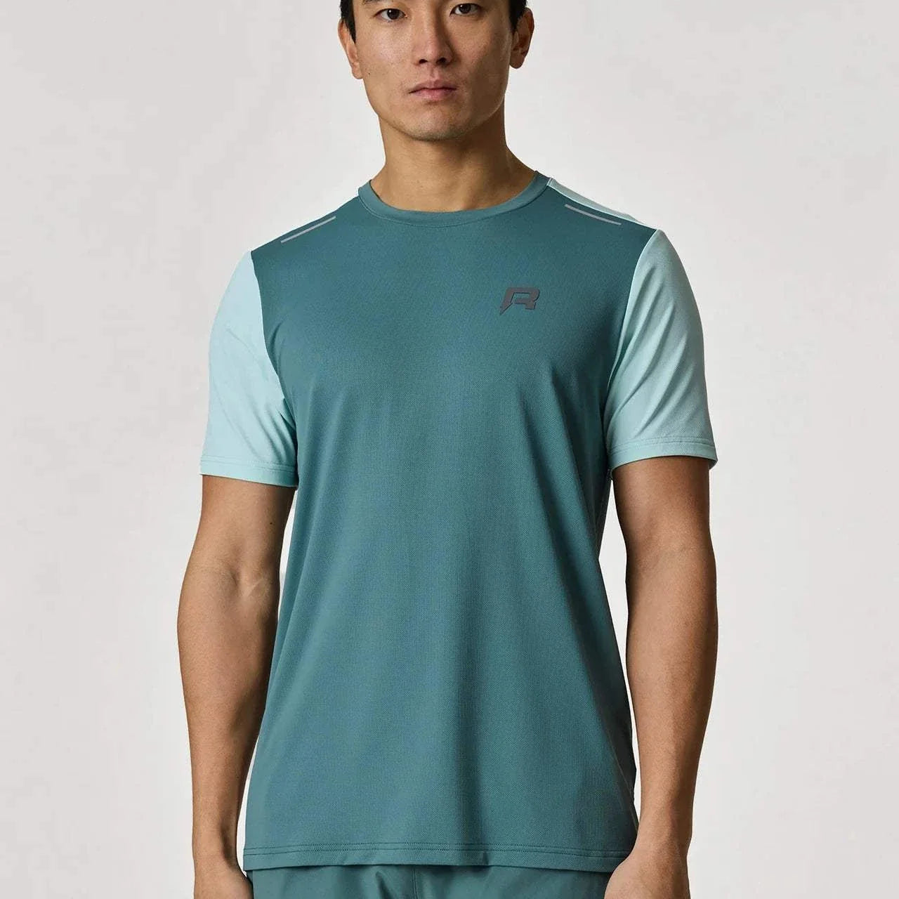 Reprimo Flight T-Shirt in Forest Green and Mint color worn by model.