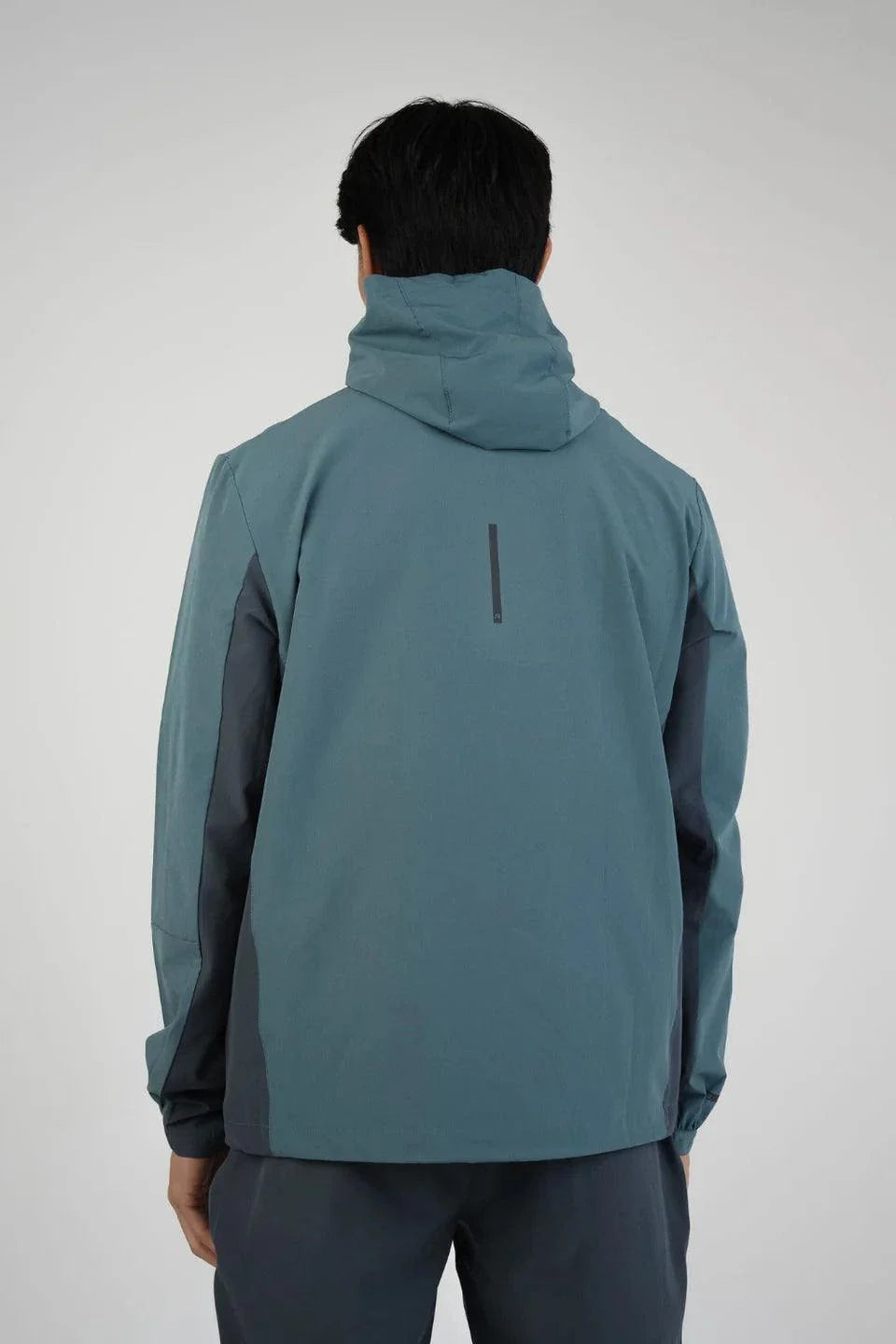 Reprimo Glide Jacket in Azure/Shadow Blue shown from the back.