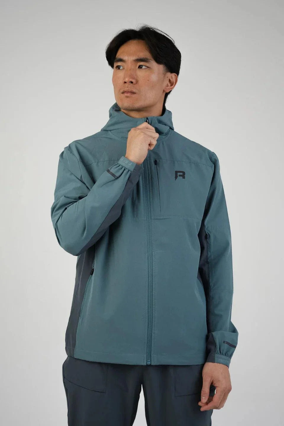 Reprimo Glide Jacket in Azure/Shadow Blue worn by model.