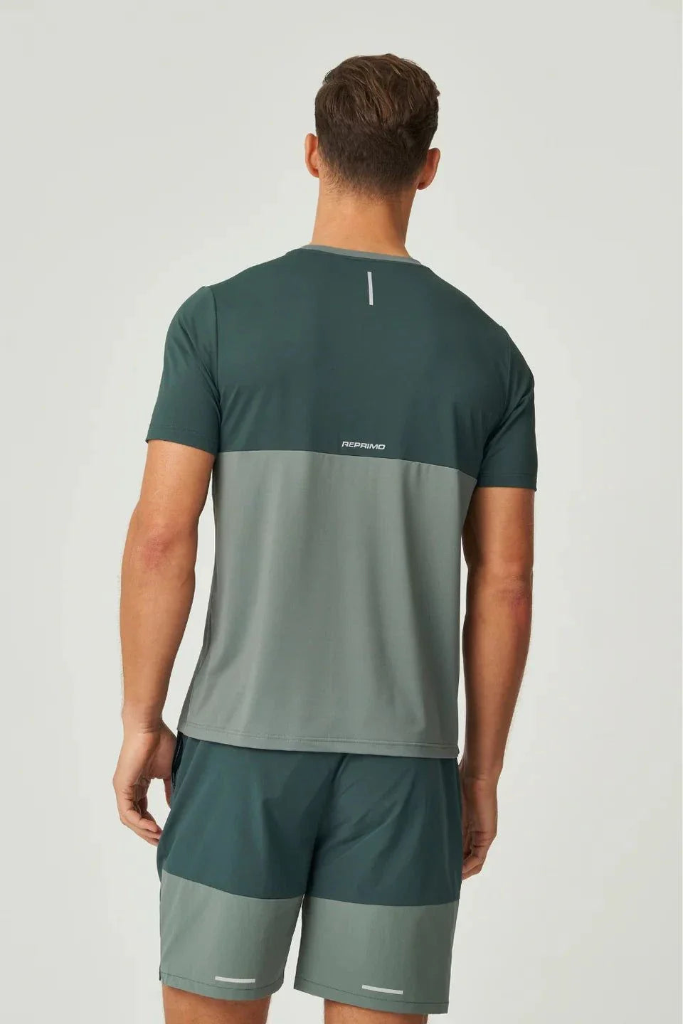 Reprimo Flight T-Shirt in hunter green and botanical with lightweight breathable fabric and reflective strips for visibility
