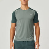 Reprimo Flight T-Shirt in hunter green with botanical accents, lightweight breathable athletic fit for high-intensity workouts, featuring reflective strips for visibility.