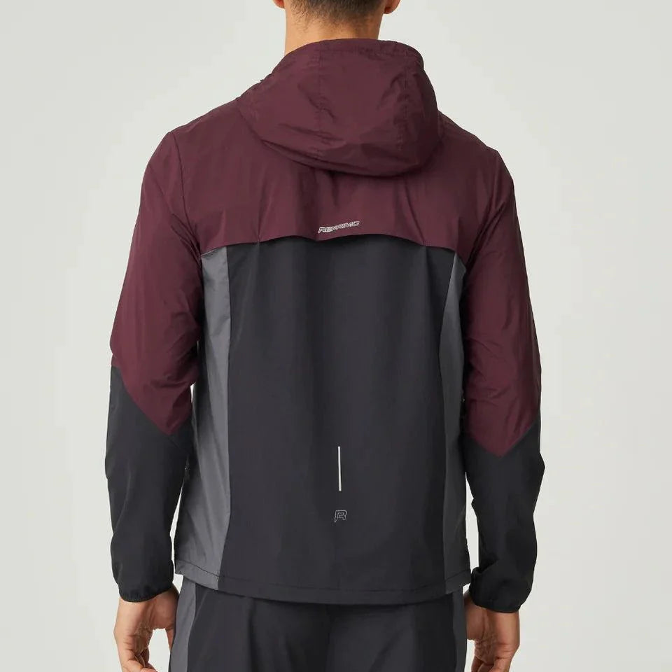 Back view of man wearing burgundy and obsidian Reprimo Impact Windbreaker with hood and dual-fabric construction.