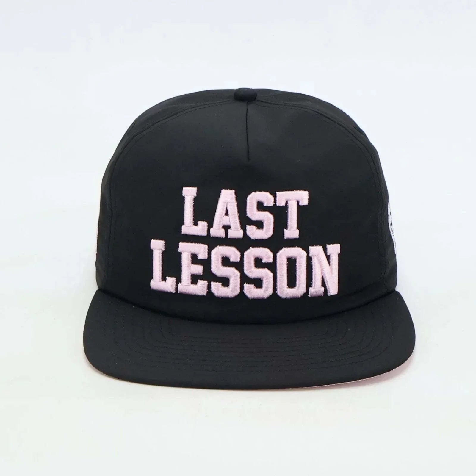 Black Last Lesson SnapBack Hat with bold white lettering.
