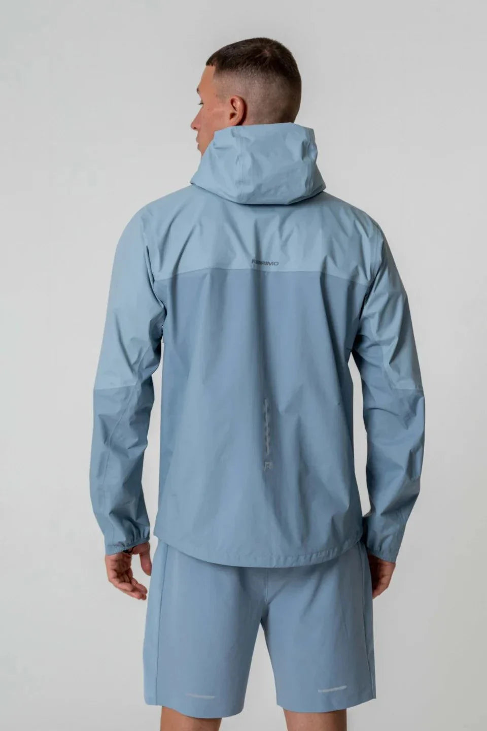 Reprimo Nova Jacket in Aqua and Dusk Blue, back view.