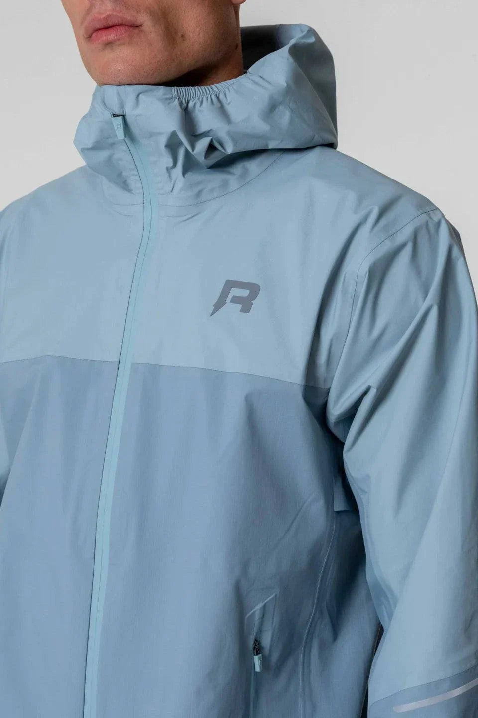 Reprimo Nova Jacket in Aqua and Dusk Blue with hood.
