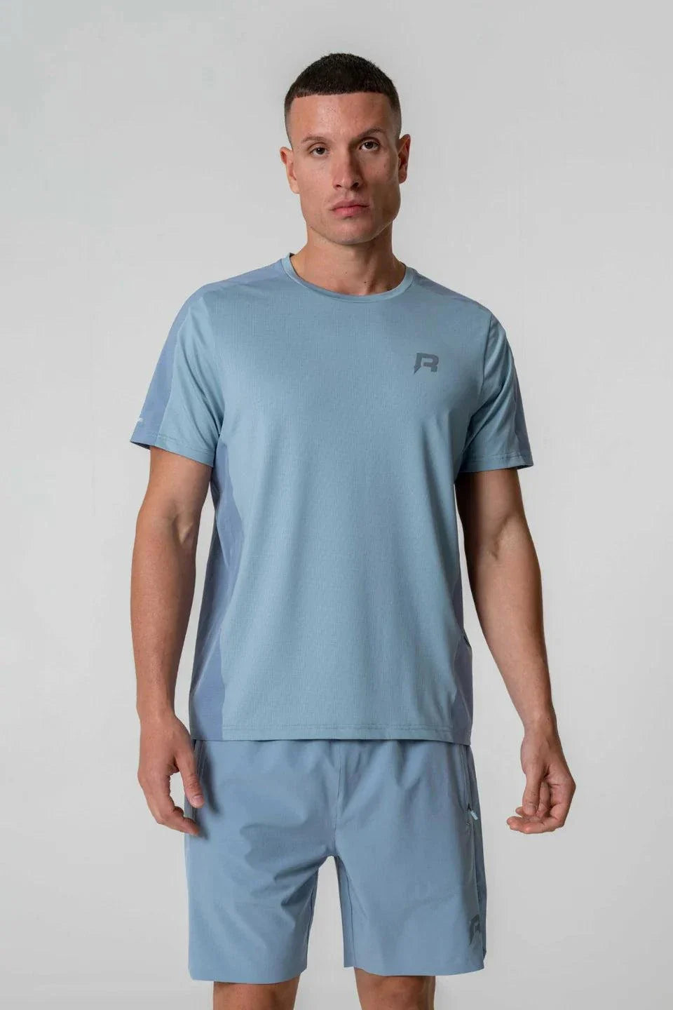 Reprimo Nova T-Shirt in Aqua/Dusk Blue color, worn by a model.