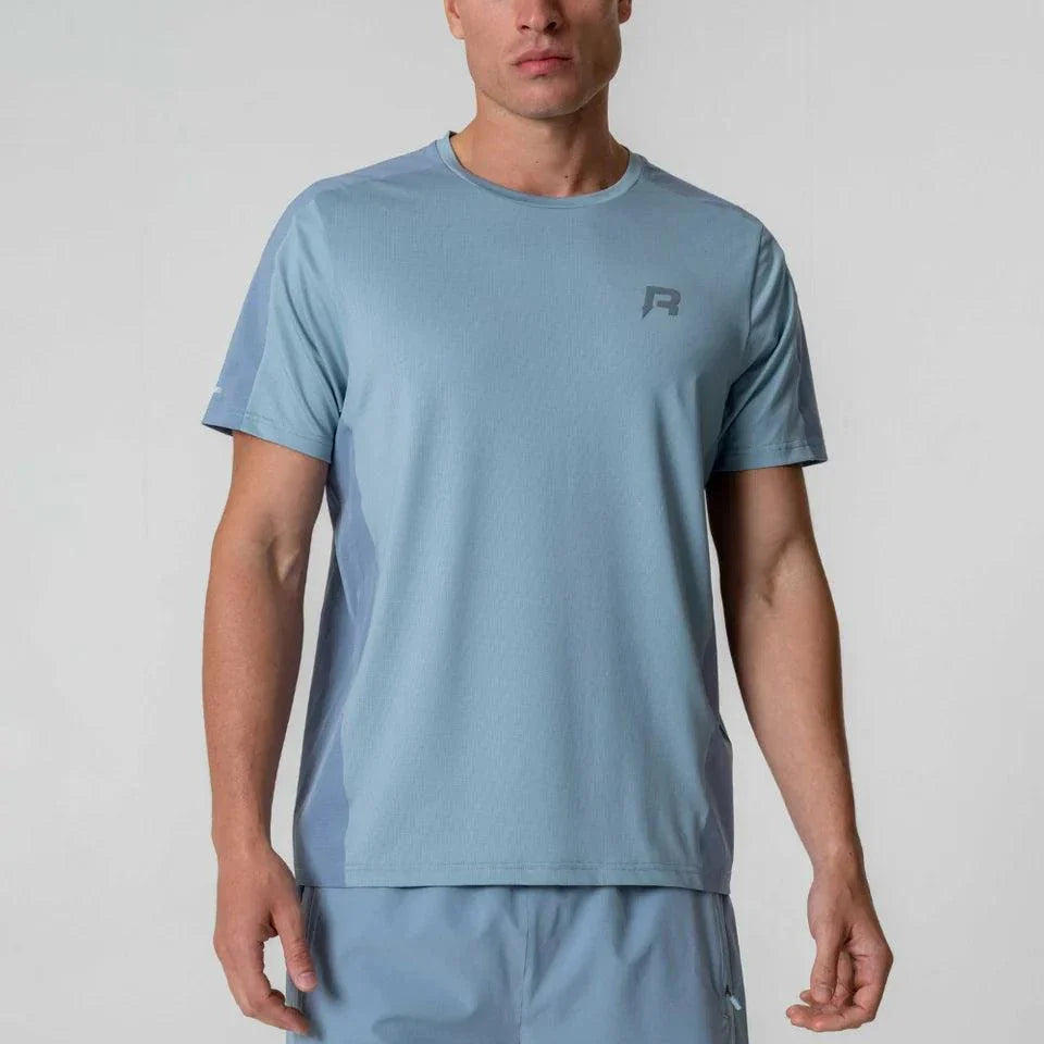 Reprimo Nova T-Shirt in Aqua/Dusk Blue color, worn by a model.
