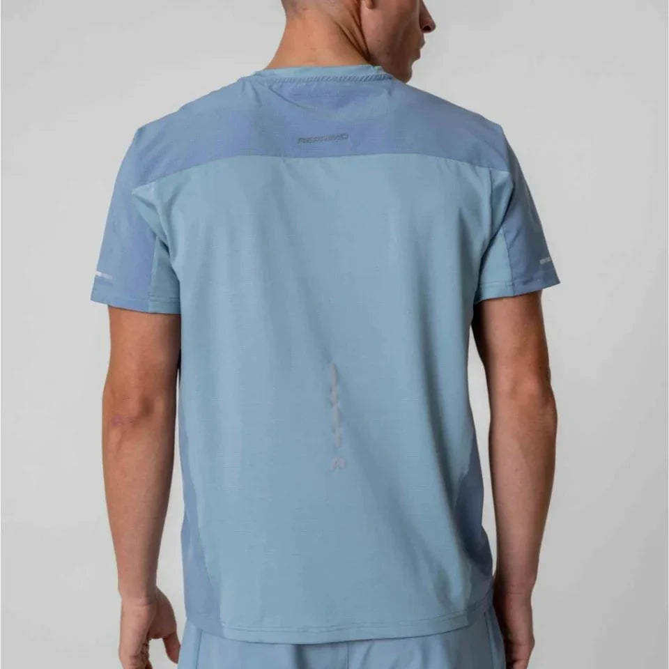 Reprimo Nova T-Shirt in Aqua and Dusk Blue worn by model, back view.