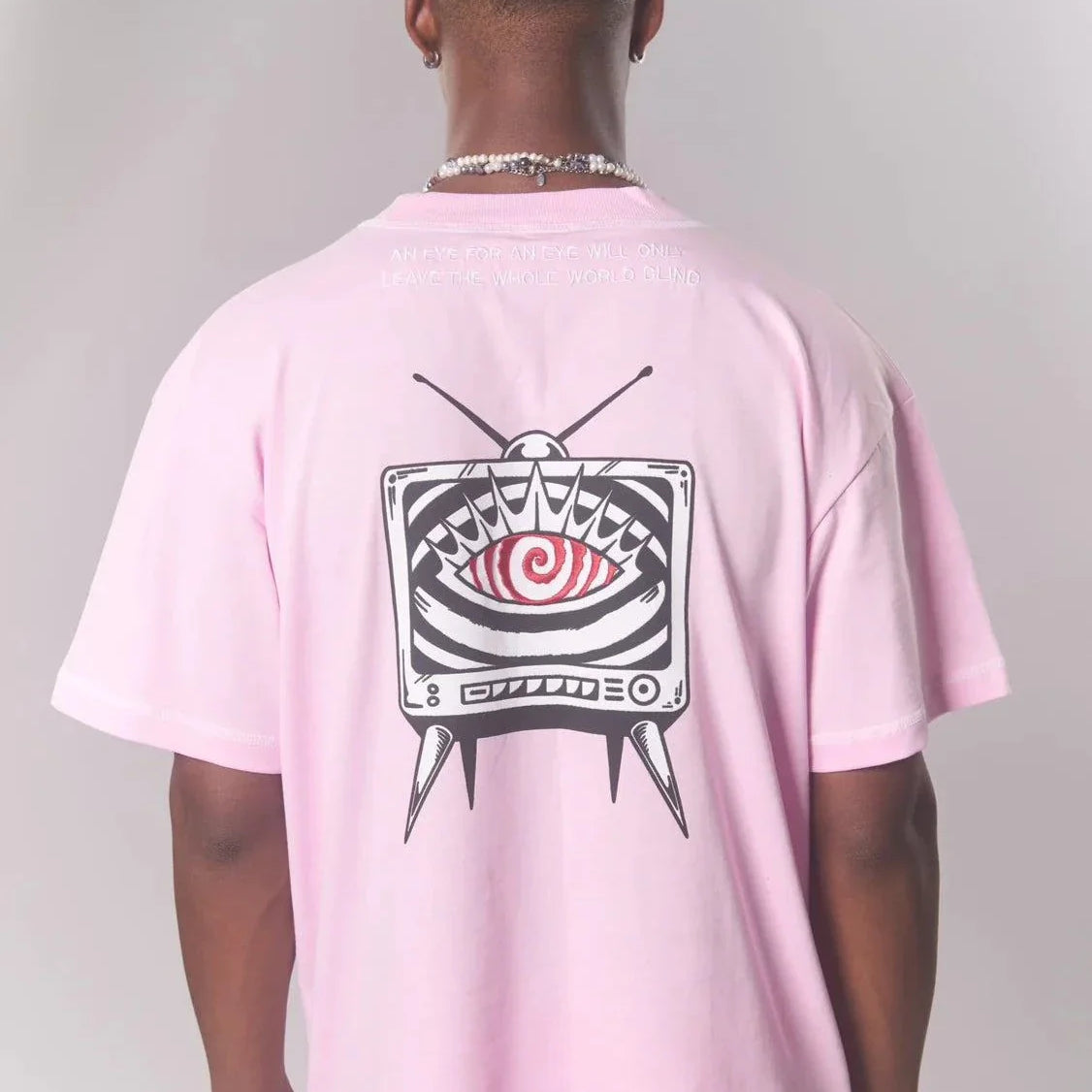Last Lesson pink T-shirt with abstract TV design on back.