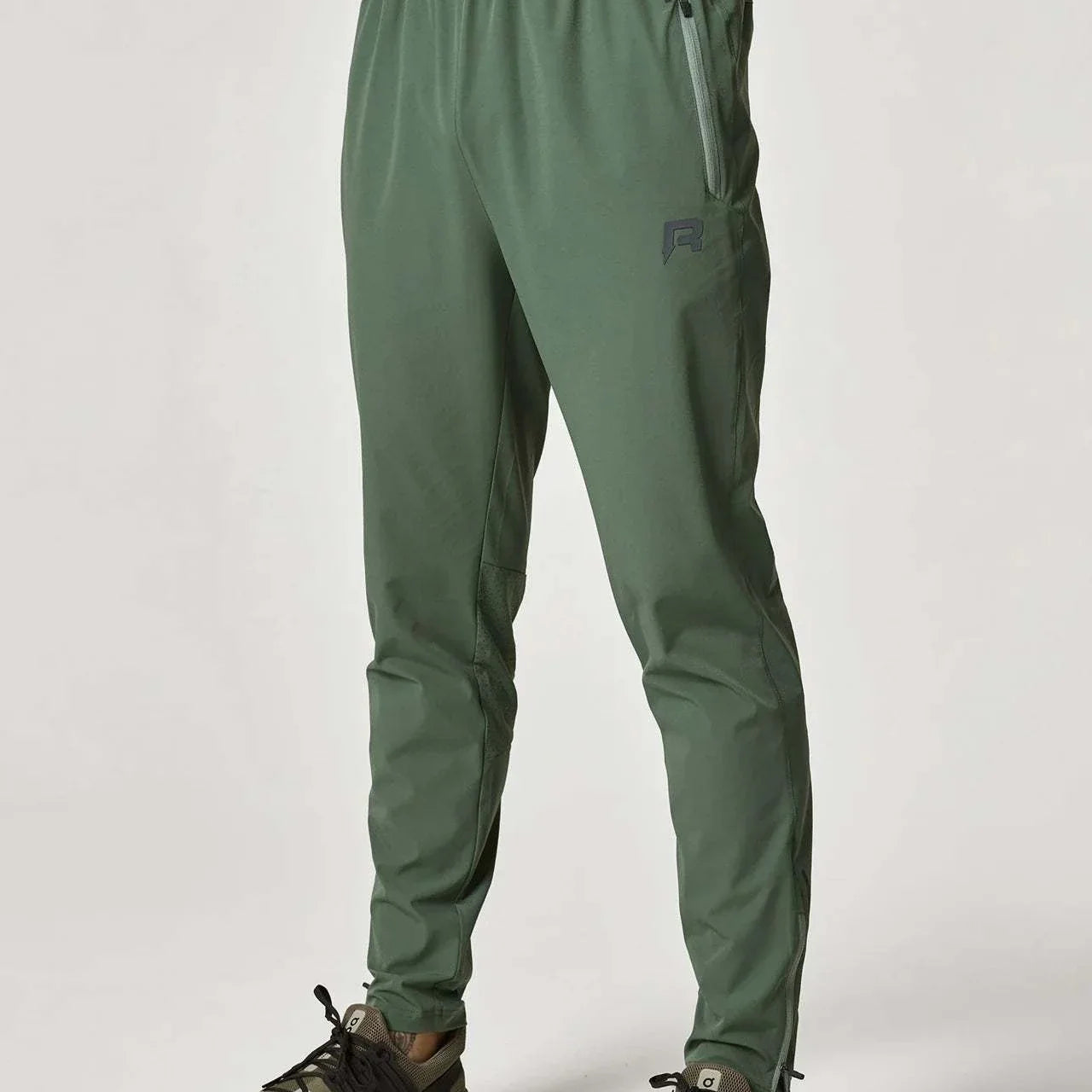 Reprimo Xcelerate Pants in Sage/Botanical color worn by male model.