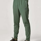 Reprimo Xcelerate Pants in Sage/Botanical color worn by male model.