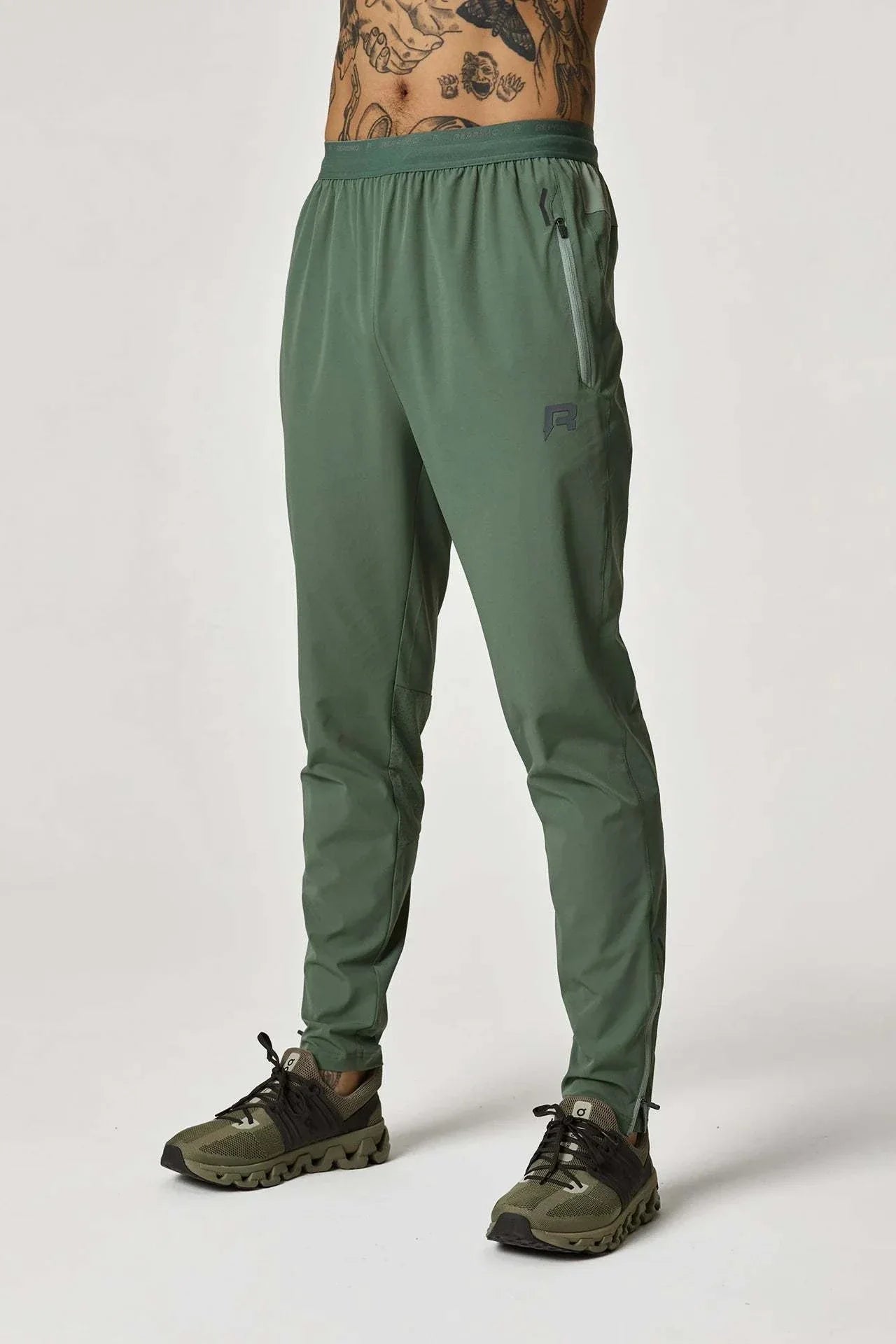 Reprimo Xcelerate Pants in Sage/Botanical color worn by male model.