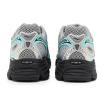Saucony Progrid Omni 9 running shoe in silver, teal, and grey colors