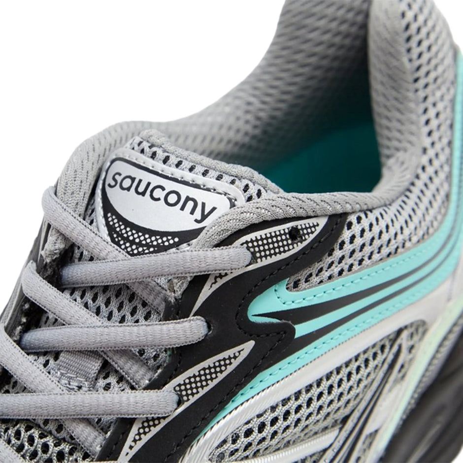 Saucony Progrid Omni 9 running shoe in silver, teal, and grey colors