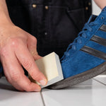 SneakersER natural rubber suede cleaning block used on blue suede sneaker to remove scuffs and stains