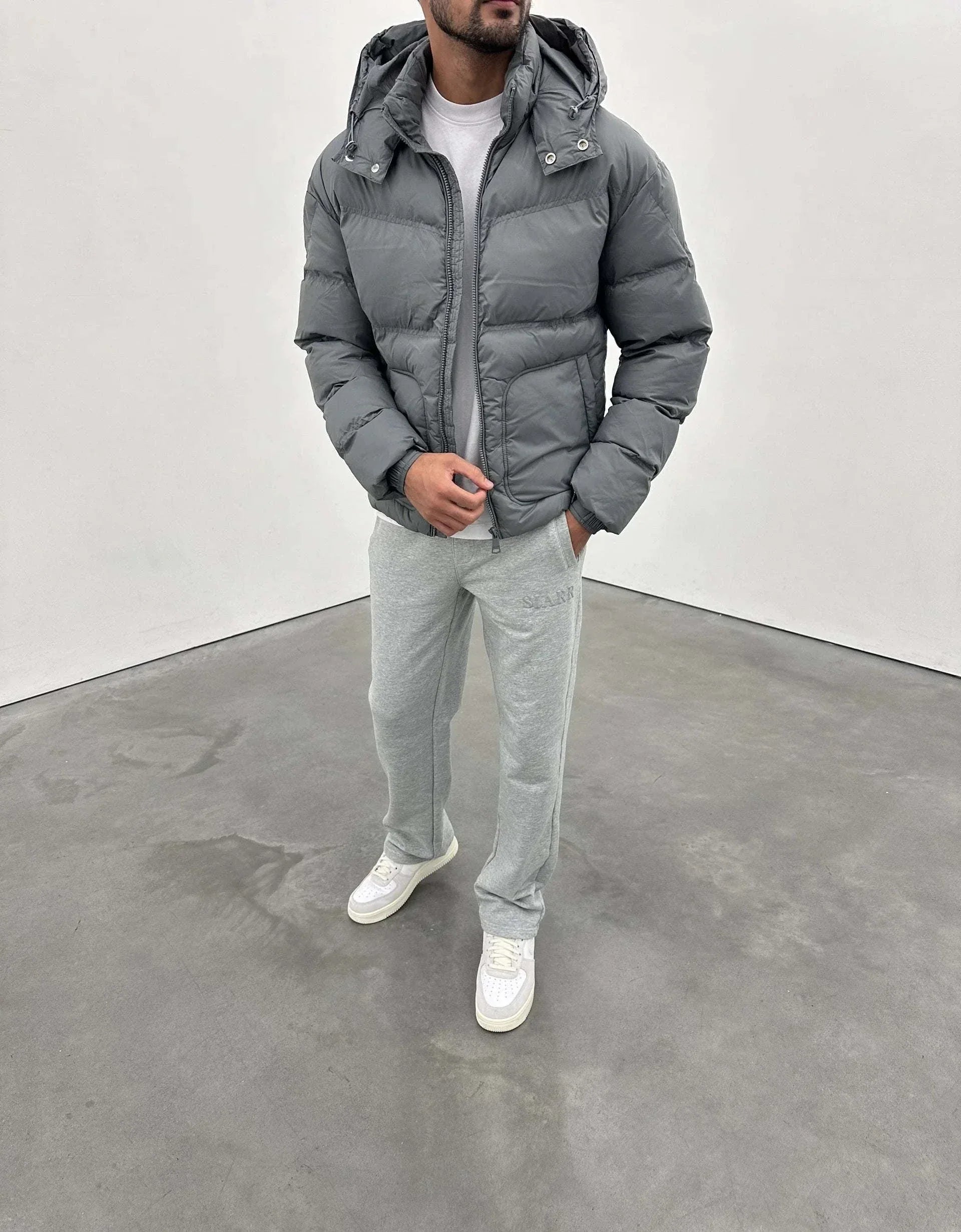 Siarr Lightweight Jacket in Green Slate with detachable hood and zip pockets.