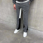 Siarr Flared Joggers in dark grey with black inside leg panelling and side slit pockets.