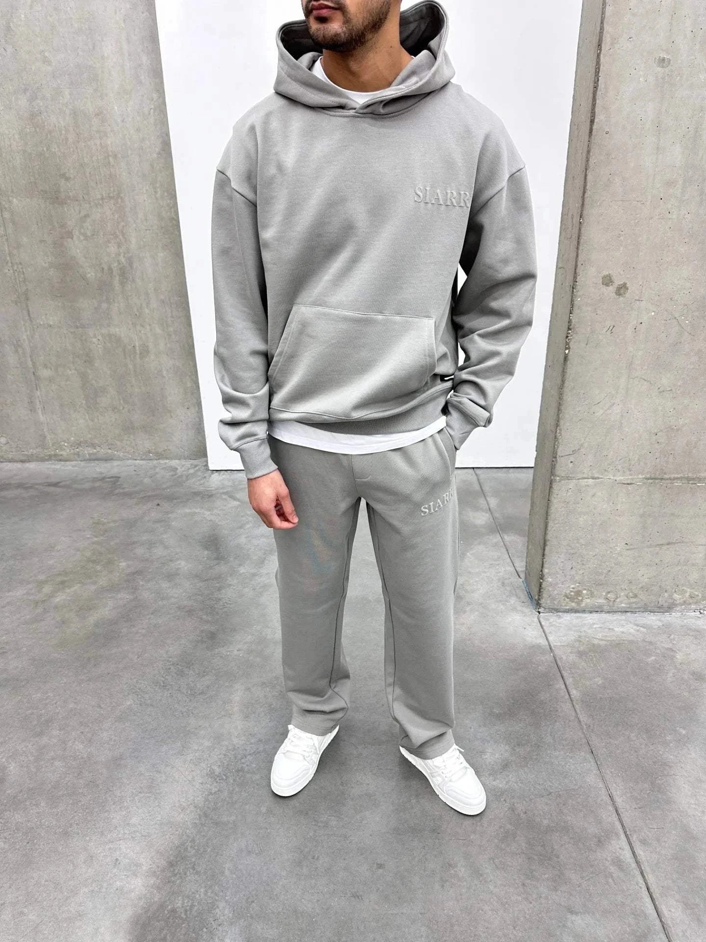 Siarr Puff Hoodie Dove Grey pullover with kangaroo pocket and elevated puff print in regular fit cotton