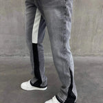 Siarr Flared Jeans light grey denim with black contrast inner seam and hem, slim flared fit with multiple pockets