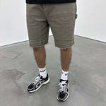 Siarr Rio Shorts Sage with raw hem and branded detailing.