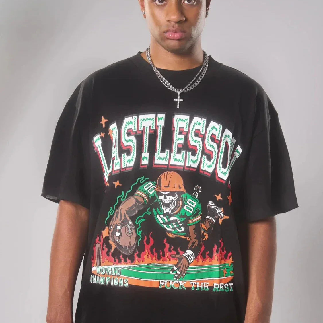 Last Lesson Touch Down Black T-Shirt featuring colorful graphic design.
