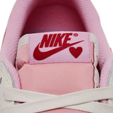 Travis Scott x Air Jordan 1 Retro Low OG Sail Tropical Pink sneakers with reverse Swoosh and vibrant pink accents