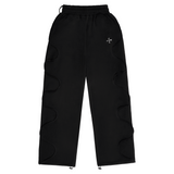 Black Saint Mind Wavy baggy sweatpants with metallic logo, side pockets, ribbed waistband, and adjustable ankle toggles