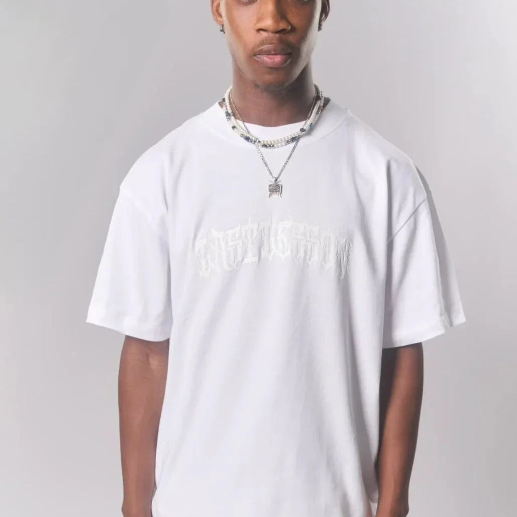 Last Lesson White Puff Print T-shirt worn by a model.