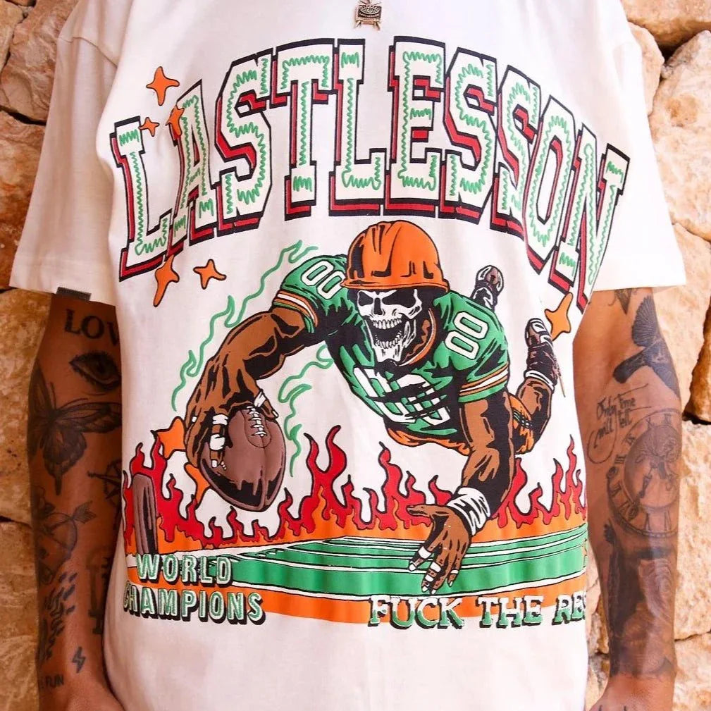 Last Lesson Touch Down White T-shirt with graphic football design.