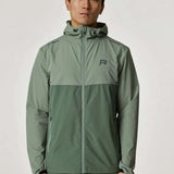 Reprimo Xcelerate Windbreaker in sage and botanical colors worn by a model.