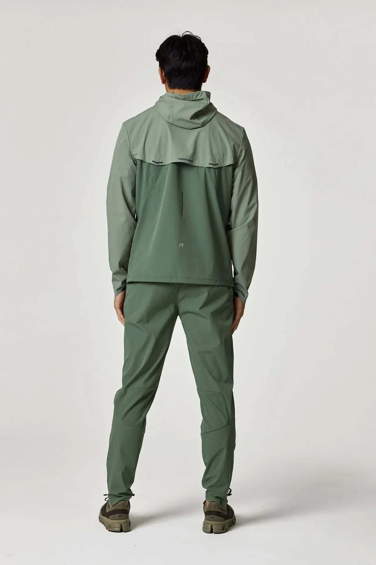 Reprimo Xcelerate Windbreaker in Sage/Botanical, back view.