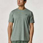 Reprimo Xcelerate T-Shirt in Sage color worn by a model.