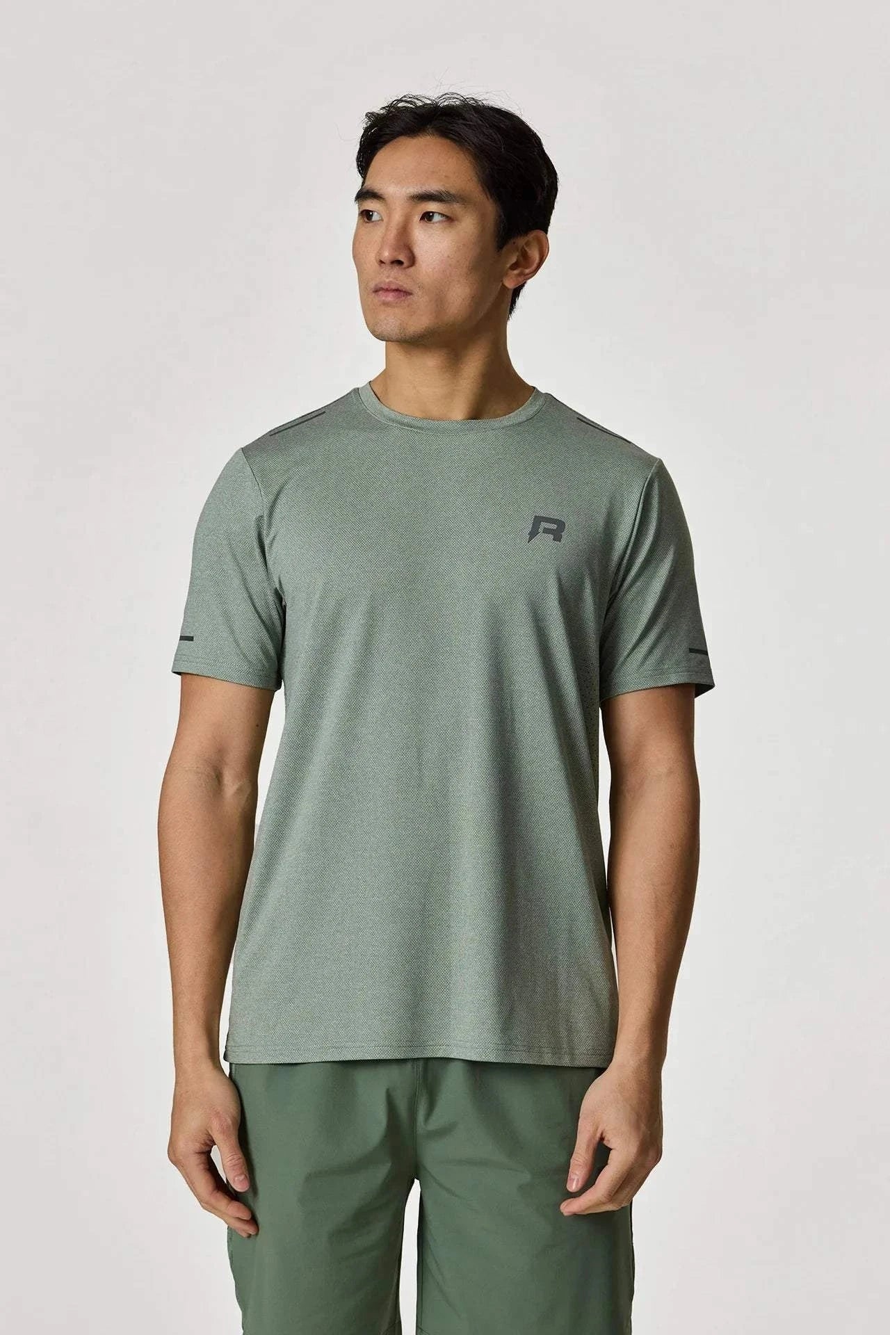 Reprimo Xcelerate T-Shirt in Sage color worn by a model.