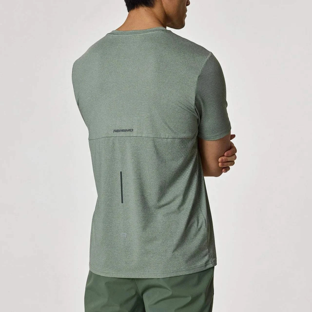Reprimo Xcelerate T-Shirt in sage green worn by a model.