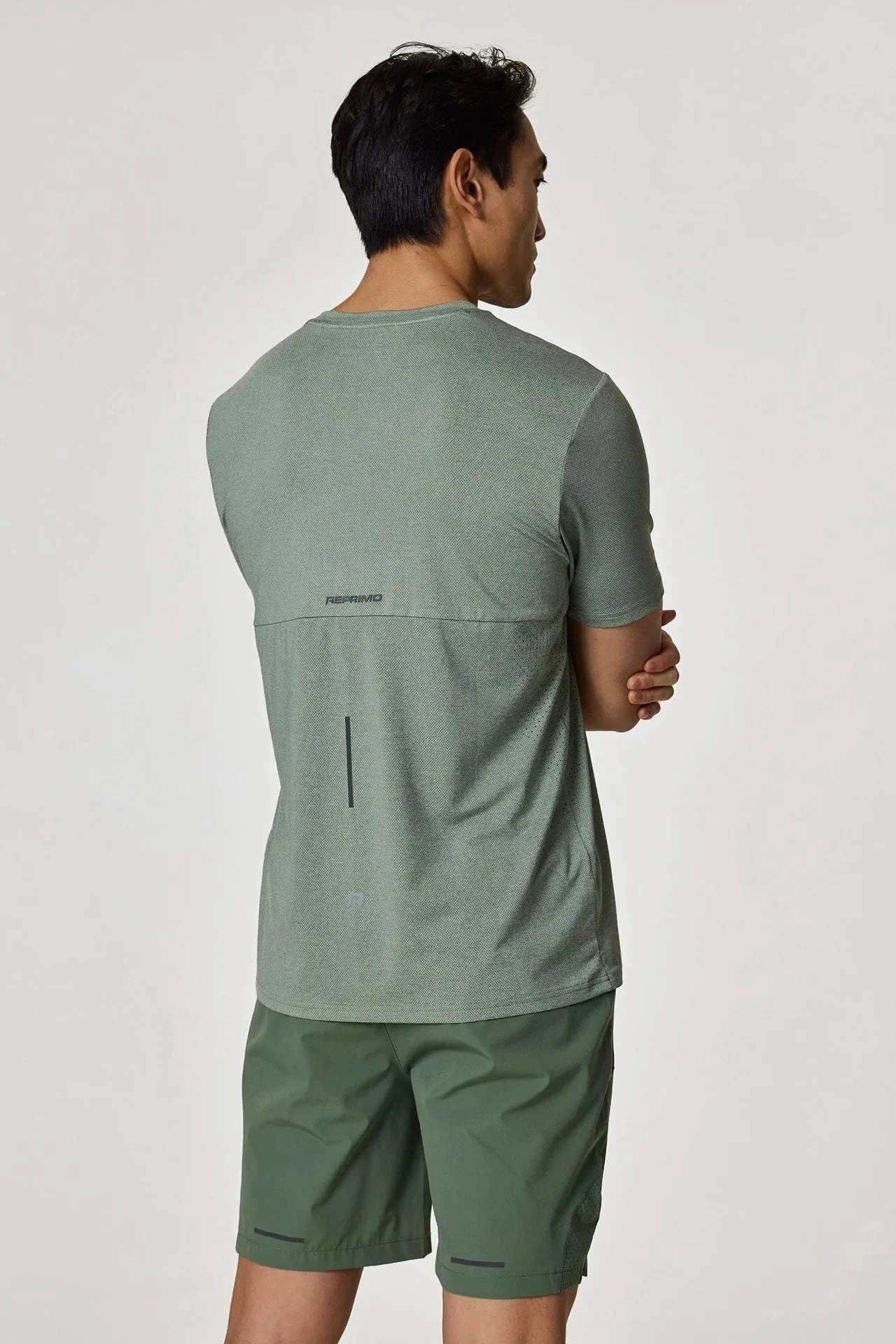 Reprimo Xcelerate T-Shirt in sage green worn by a model.