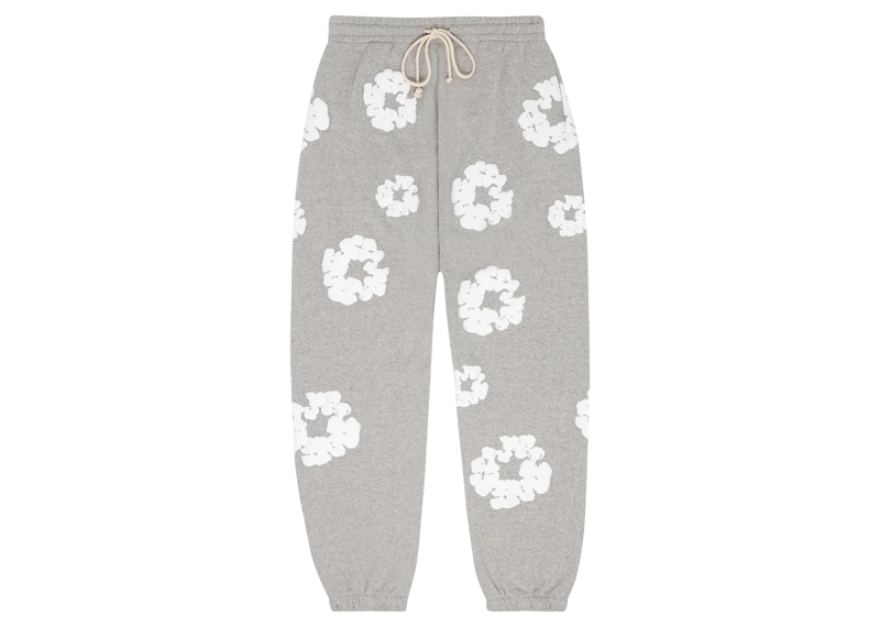 Denim Tears Cotton Wreath Sweatpants in Grey with white floral pattern.